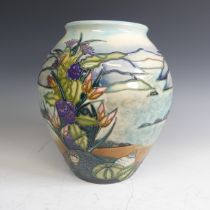 A Moorcroft pottery 'Islay' pattern baluster Vase, tube lined decoration of coastal scene, factory