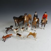A Beswick pottery Hunt, comprising a red coat rider, a black coat rider, two foals, three hounds,