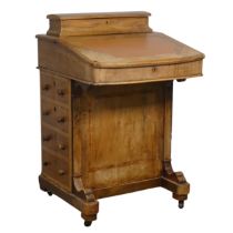 A Victorian inlaid slopefront walnut Davenport, with writing skiver, above four drawers and four
