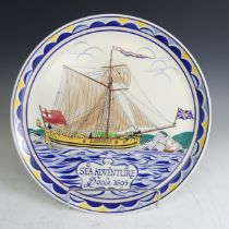 A Poole Pottery 'Sea Adventure' memorial Charger, designed by Arthur Bradbury and painted by Karen