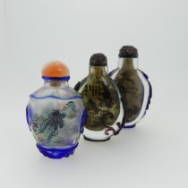 A Chinese interior painted and overlayed glass Snuff Bottle, with interior scene of villagers