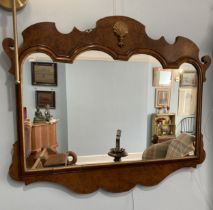 A 18thC style walnut wall Mirror, with moulded frame and carved gilt shell ornament to the cresting,