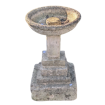 A weathered reconstituted stone Birdbath, raised on plinth base, W 41 cm x H 58 cm x D 41 cm.