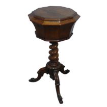 A 19th century William IV Mahogany Teapoy, the octagonal hinged lid enclosing two lidded caddies and