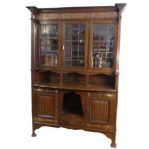 A Shapland and Petter, Barnstable, Arts and Crafts oak Bookcase, circa 1900, the projecting