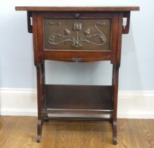 An Arts and Crafts oak Desk/side Cabinet, the rectangular top above a hinged fall front with inset