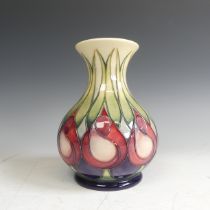 A Moorcroft pottery 'April Tulips' pattern Vase, decorated with stylised flowers, factory marks to