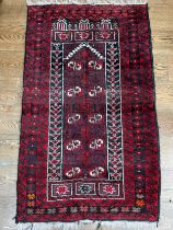 Tribal Rugs; an Afghan red-ground rug, 100% wool, 153cm x 89cm.