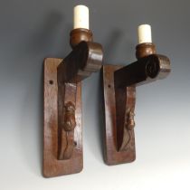 Robert 'Mouseman' Thompson of Kilburn: A pair of English oak Wall Lights, scrolled support on square