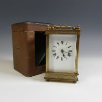 A 20th Century cased French 8 day gilt brass Carriage Clock, with engraved foliate edges, H 13 cm.