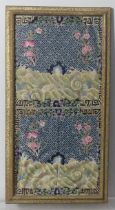 A rectangular fragment of an antique embroidered Chinese Gown, 45.5cm x 23cm, framed, together