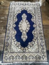 Tribal Rugs; a Persian hand knotted rug, wool pile on cotton base, the royal blue ground with