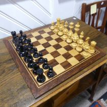 A Staunton pattern boxwood and ebony Chess Set, the knights with glass eyes, kings 10.5 cm, with box