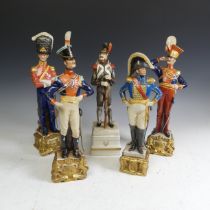 A set of four Continental porcelain Napoleonic soldier Figures, with overglaze crown N mark,