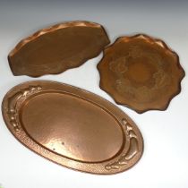 An Arts and Crafts oval hammered copper Tray, handles with Art Nouveau inspired heart motifs, W 57