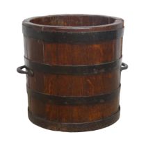 A Vintage metal bound oak circular coal bucket, with carrying handles to each side, W 34 cm x H 36