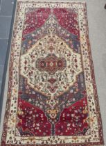 Tribal Rugs; a large Persian Qashqai Rug, red, cream and grey ground with all over typical patterns,