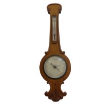 An Early 20th century oak cased Barometer, the white face inscribed 'Storm - Rain - Change -