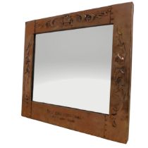 A Scottish Arts and Crafts copper wall Mirror, of a small rectangular form, with embossed thistles