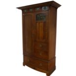 A Shapland and Petter of Barnstaple, Arts and Crafts oak Wardrobe, circa 1900, the projecting