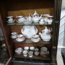 A Royal Albert 'Autumn Roses' Tea Service, comprising seven Tea Cups and eight Saucers, Teapot,