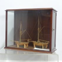 A pair of 19th century model Ships in display case, by Martin Brydon, a sailor who was held prisoner