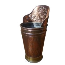 An Arts and Crafts copper Grape Hod, embossed with Art Nouveau inspired foliage, and brass fittings,