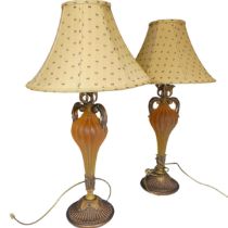 A pair of Antique frosted amber resin and gilt wood table Lamps, H 76 cm.