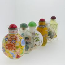 A Chinese glass Snuff Bottle, of yellow ground painted with floral enamels, red stone stopper, three