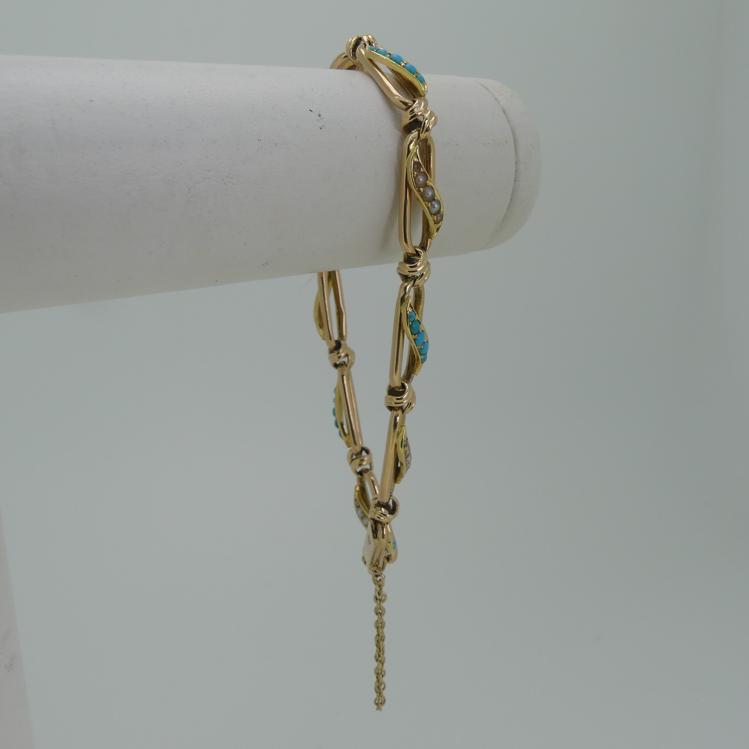 A 15ct yellow gold, seed pearl and turquoise Bracelet, the open oval links with alternate centres of - Image 3 of 3