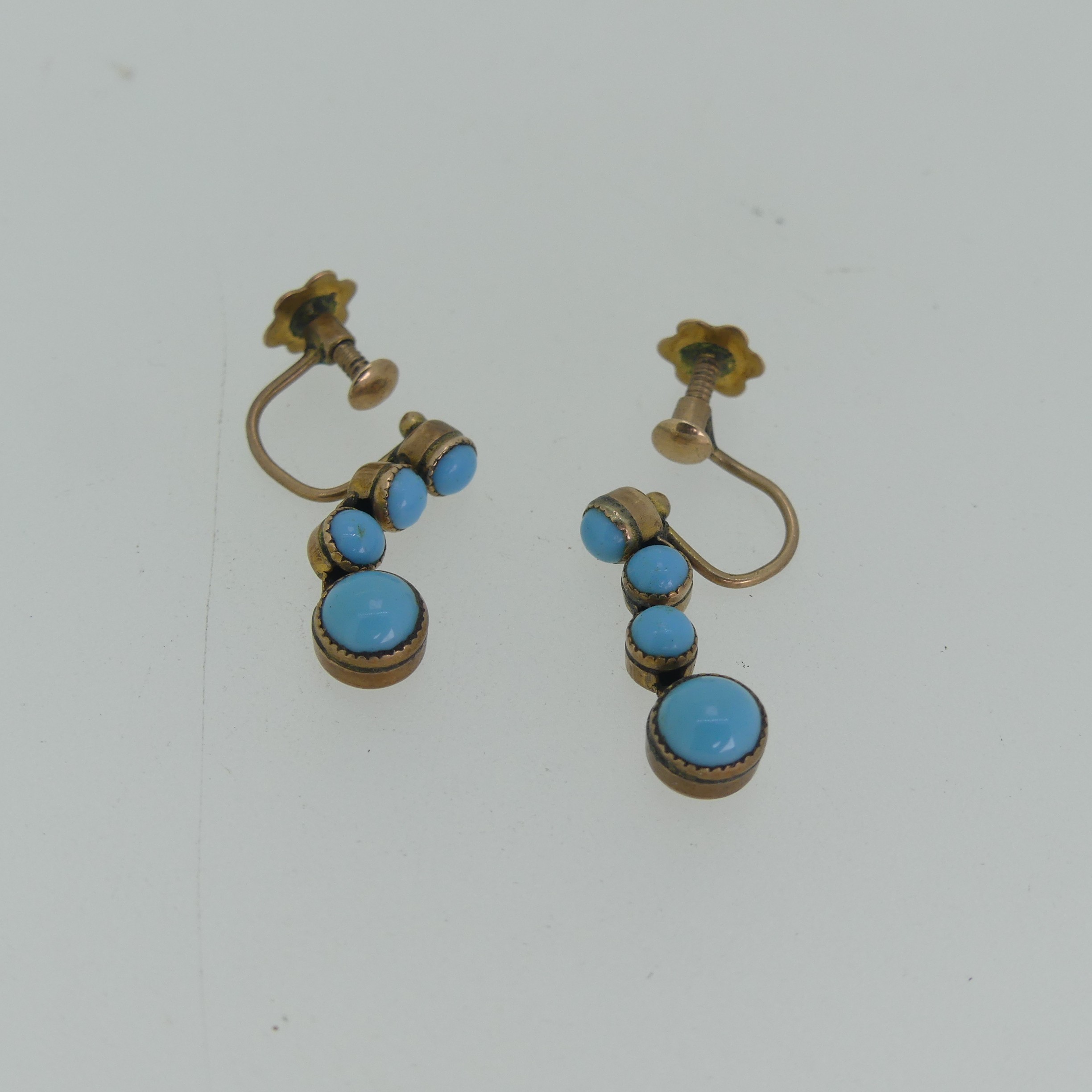 A pair of early 20thC turquoise Earrings, formed as drops of four cabochon stones, all mounted in - Image 6 of 6