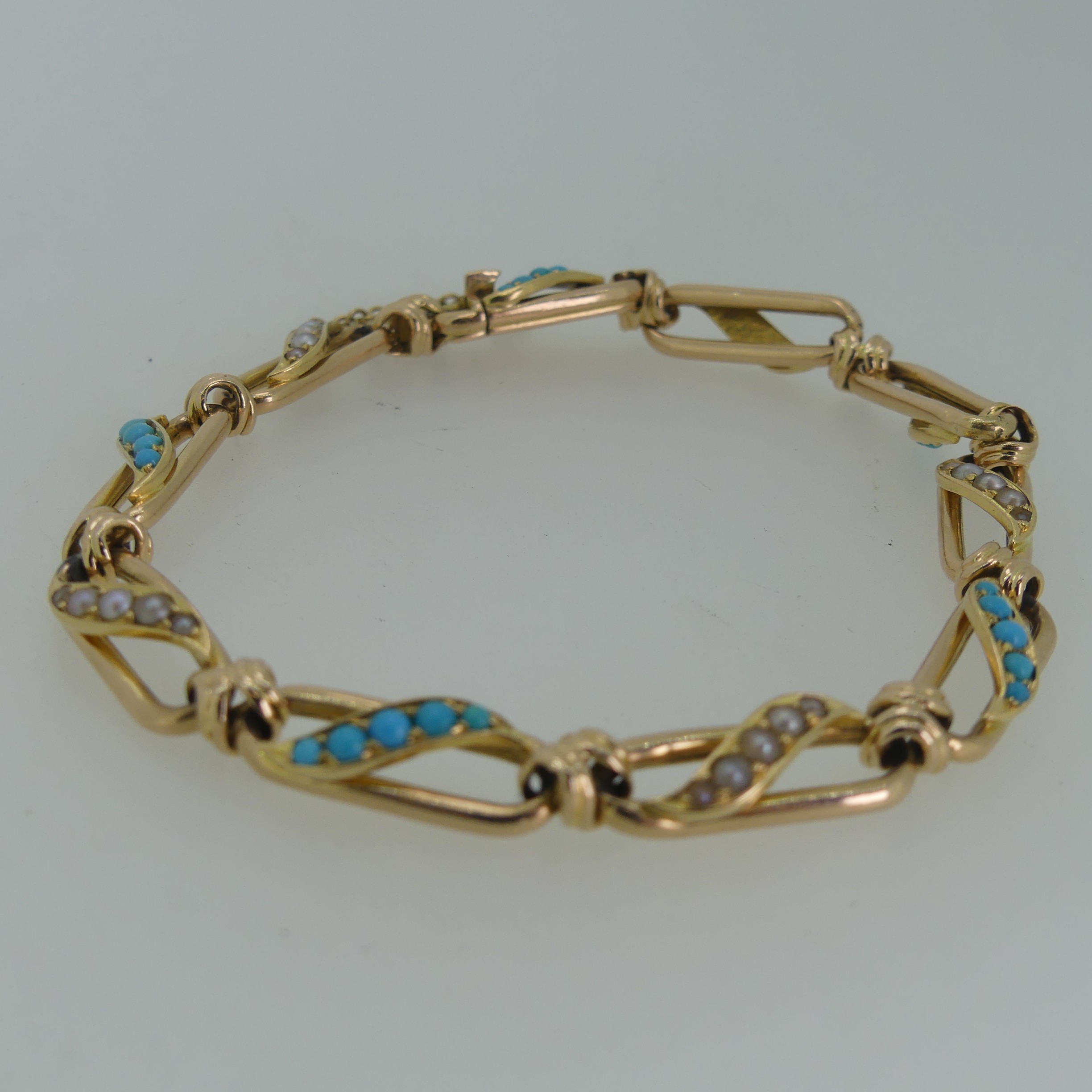 A 15ct yellow gold, seed pearl and turquoise Bracelet, the open oval links with alternate centres of - Image 2 of 3