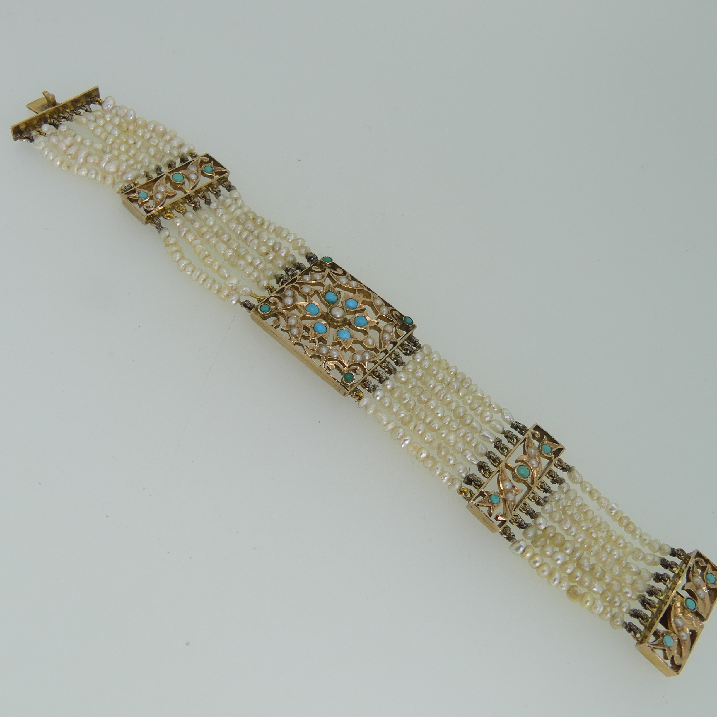 An antique multi-strand seed pearl Bracelet, in the Regency style with a central foliate pierced - Image 2 of 3