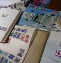 Stamps: A collection of stamps in four albums and loose with GB year packs and books (a lot)