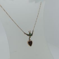 An antique 9ct gold Swallow Pendant, set turquoise and seed pearls, with modifications to now be