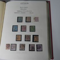 Stamps: A collection of Jamaican stamps in an album.