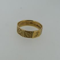 An 18ct yellow gold Band, nine sided, eight with leaf decoration, one initialled, 6.4mm wide, Size