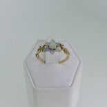 A small opal flowerhead Ring, mounted in 9ct yellow gold with scrolling open shoulders, Size O½, 1.