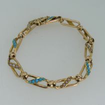 A 15ct yellow gold, seed pearl and turquoise Bracelet, the open oval links with alternate centres of