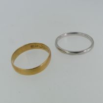 A platinum Band, Size S½, 4g, together with an 18ct yellow gold band, mis-shapen, Size S½, 2.4g (2)