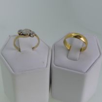 Withdrawn; An 18ct yellow gold Band, Size J, 2.1g, together with a very small three stone diamond ri