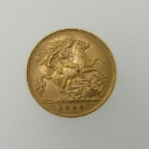 An Edwardian gold half Sovereign, dated 1909.