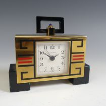 Cartier; An Art Deco style brass and enamel Alarm Clock, the case back marked 'Cartier Paris 02005',