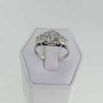 A single stone diamond Ring, approx. 1.25ct, six claw set in platinum with two graduated collet