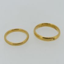 A 22ct yellow gold Band, 3.8mm wide, Size S, together with another smaller, 2.8mm wide, Size L,