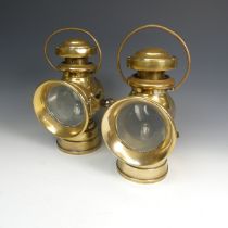 A pair of brass 'Lucas Burbury early motor car Lamps, with loop handles and screw attachments, H