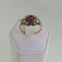 A late Victorian ruby and half pearl Ring, the four cushion cut central rubies with five small