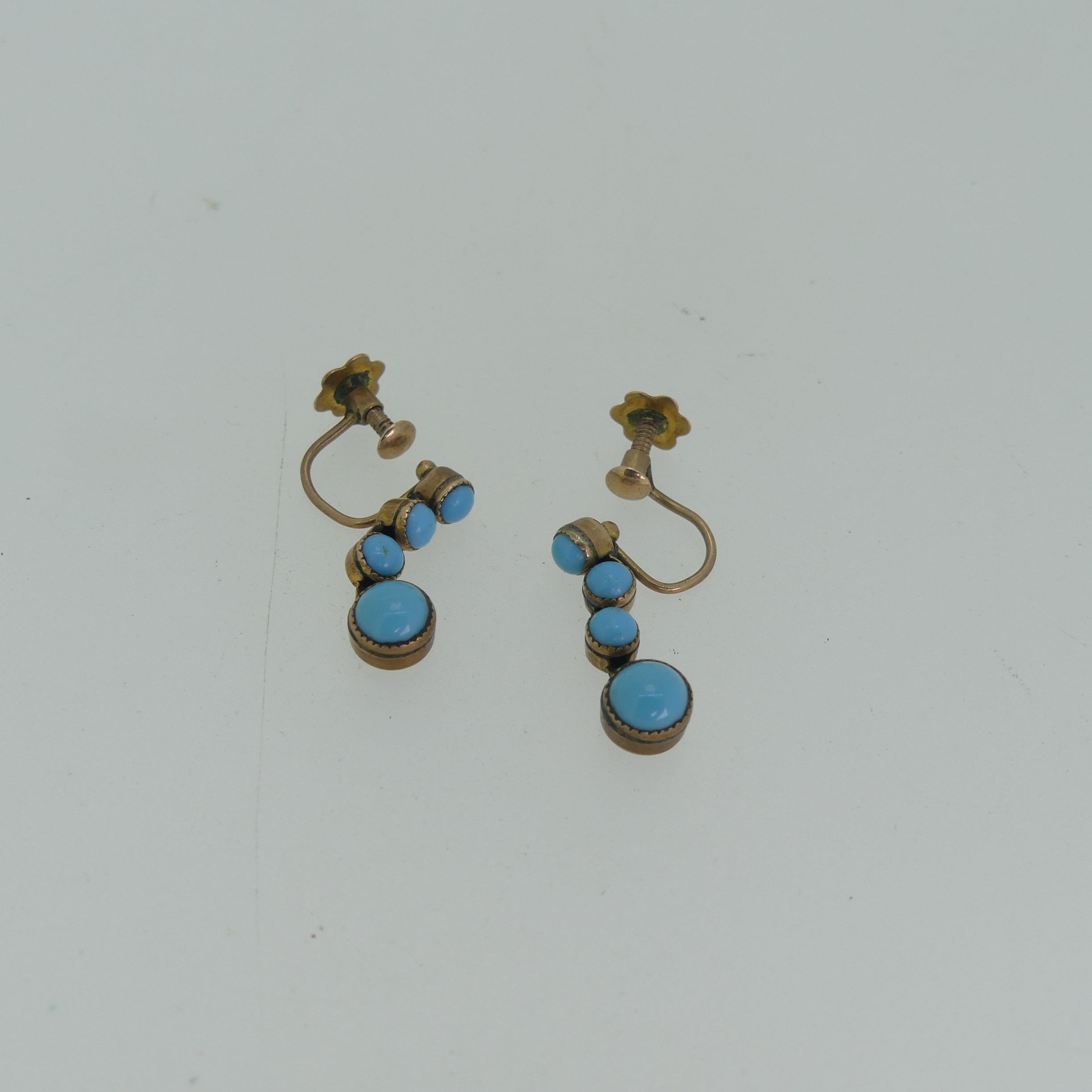 A pair of early 20thC turquoise Earrings, formed as drops of four cabochon stones, all mounted in - Image 5 of 6