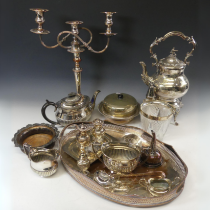 A quantity of Silver Plate, including a three light camdelabra, a spirit kettle on stand, entreé