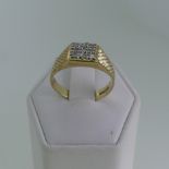 A 9ct yellow gold and diamond Ring, the squared front pavé set with nine small diamonds, textured